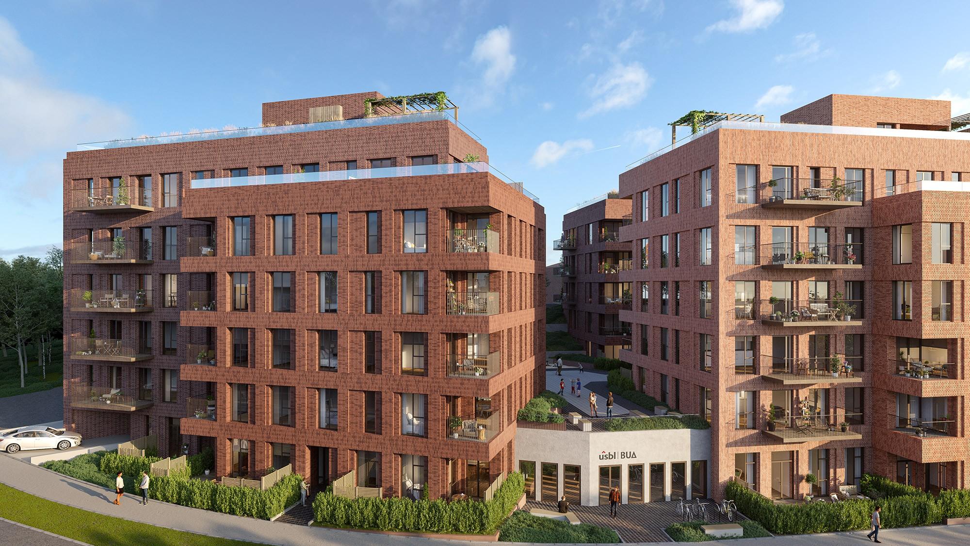 Moderne leilighetsbygg med mursteinsfasade og balkonger, omgitt av grøntområder og parkeringsplasser.