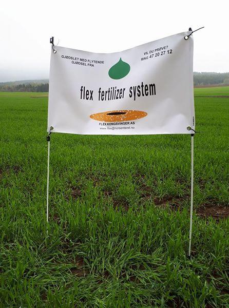 Banner for Flex Fertilizer System in a green field, promoting agricultural products and services.