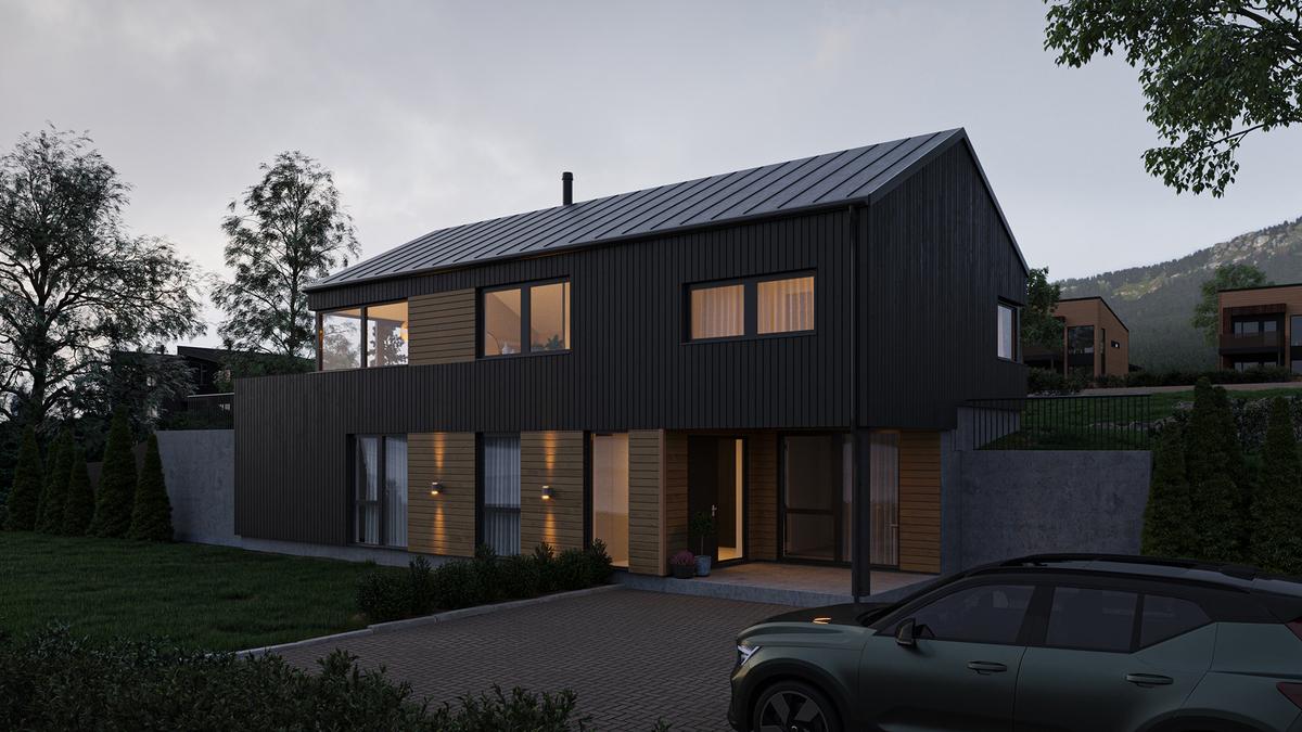 Moderne hus med mørk fasade, store vinduer og en bil parkert foran, omgitt av grønt landskap.