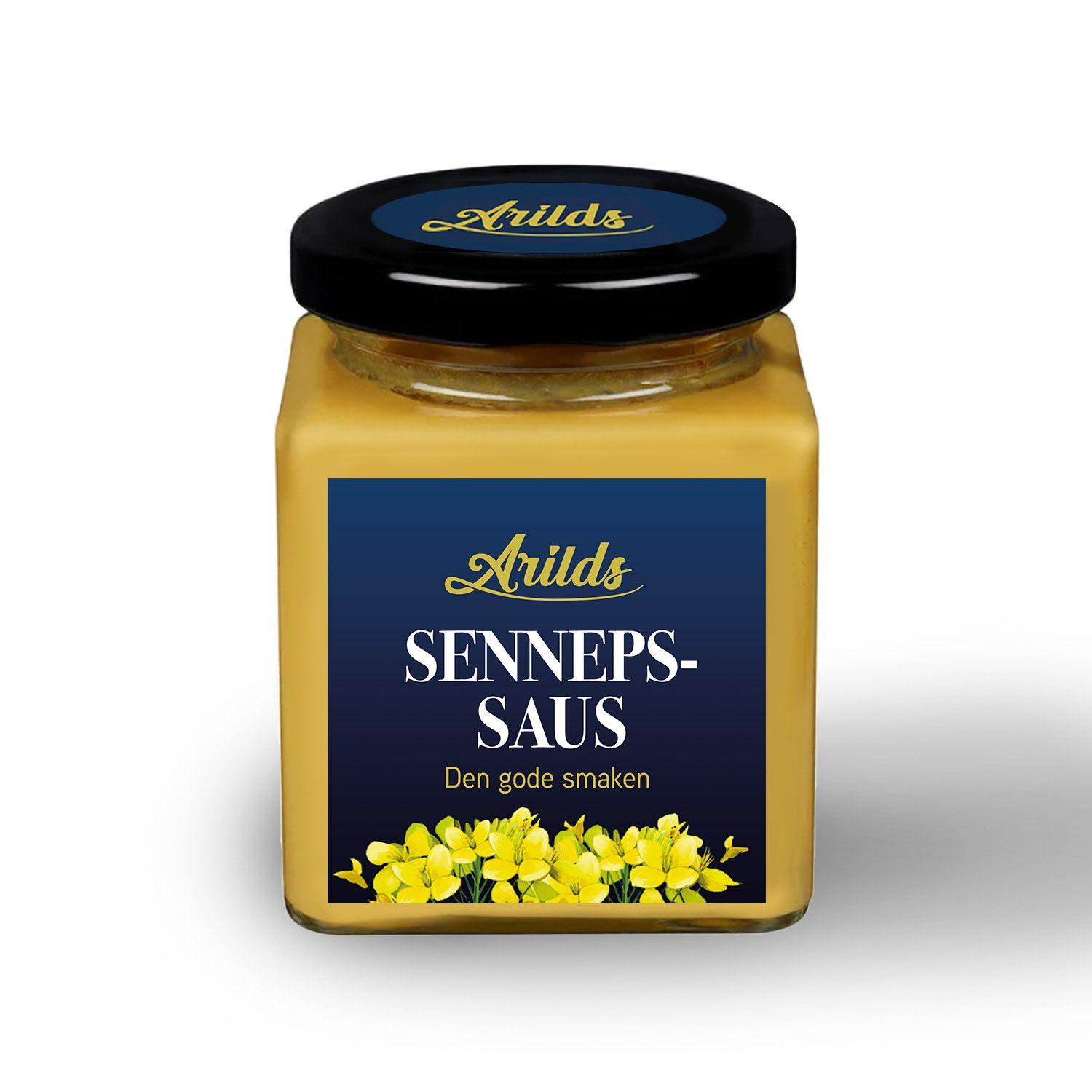 Et glass med sennepssaus fra Arilds, med en mørk blå etikett og gule blomster.