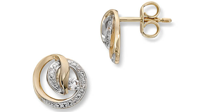 Øredobber i gull og sølv med diamanter, med en elegant spiralformet design.