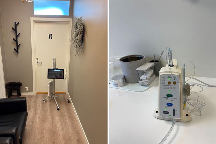 En medisinsk enhet med skjerm står på en stativ i en korridor, ved siden av en arbeidsbenk med utstyr.