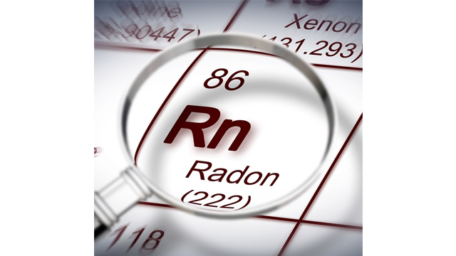 Et forstørrelsesglass over radon (Rn) i det periodiske systemet, med atomnummer 86.