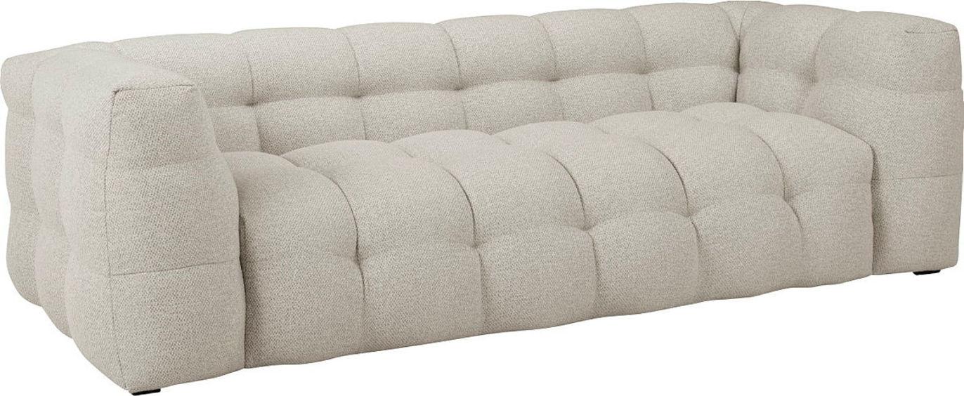 En moderne, lys sofa med tuftede puter og en minimalistisk design.