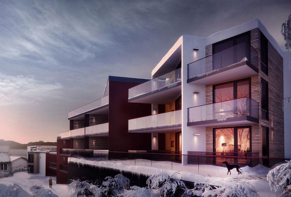 Moderne leilighetsbygg med balkonger, snødekt landskap og solnedgang i bakgrunnen.