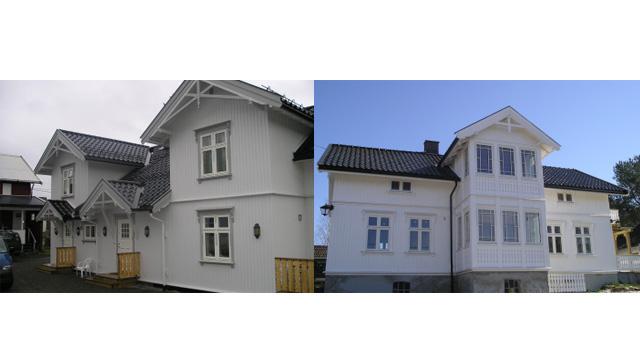 To hus med hvite fasader og tak i mørke farger, med detaljerte vinduer og balkonger.