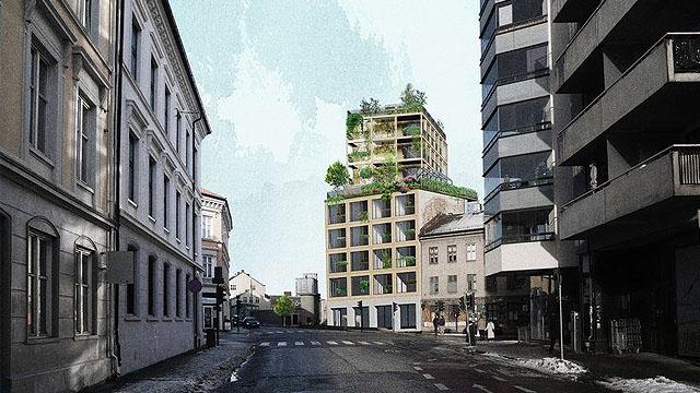 Moderne bygninger med grøntområder i en bygate, omkranset av eldre arkitektur og moderne fasader.