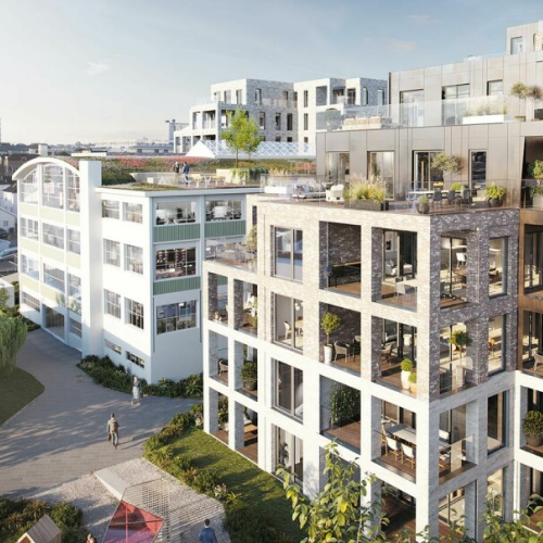 Moderne leilighetskompleks med grønne områder og balkonger, beliggende i en urban setting.
