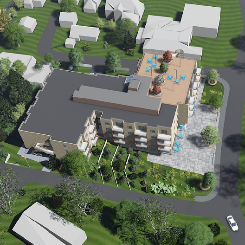 Moderne leilighetskompleks med grøntområder og parkeringsplasser i et boligområde.