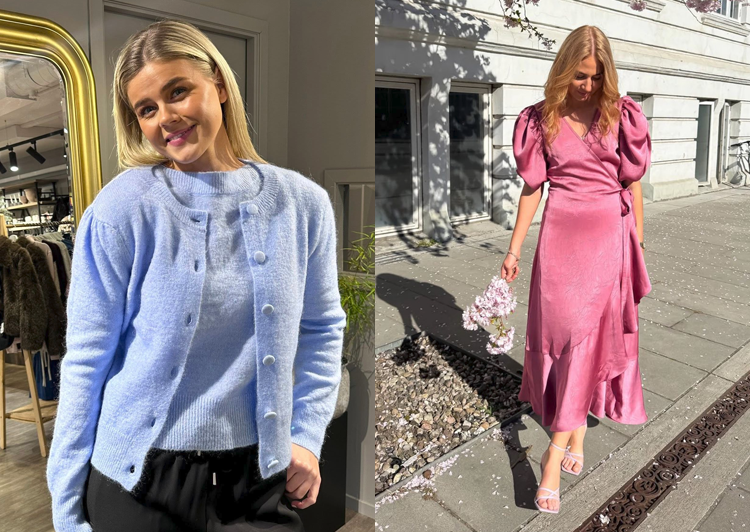 To kvinner i moteriktige antrekk, en med blå cardigan og den andre i rosa kjole, står utendørs.