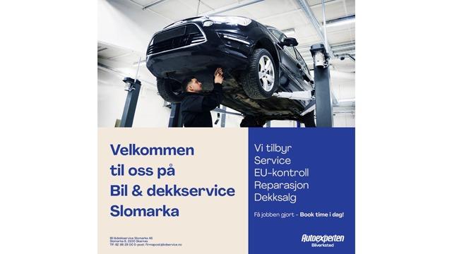 Velkommen til Bil- og dekkservice i Slomarka med en bil på heis for service og reparasjon.