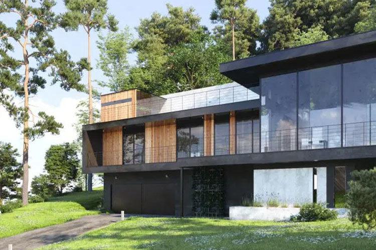 Moderne hus med store vinduer, trepanel og grønt landskap rundt.