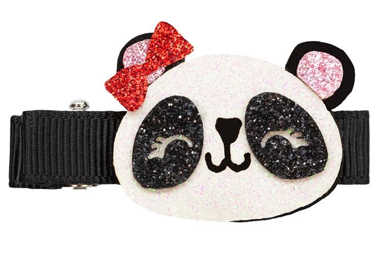 Hårspenne med panda-design, glitrende detaljer og rød sløyfe på svart bånd.