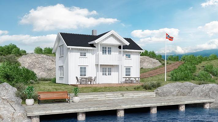 Moderne hvitt hus ved vannet med flagg, benk og terrasse, omgitt av grønne områder og steiner.