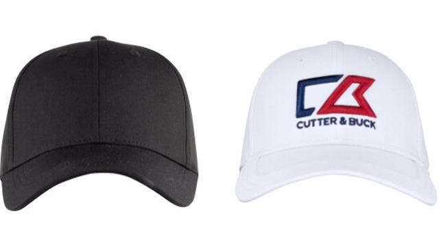 To hodeplagg, en svart caps til venstre og en hvit caps med "Cutter & Buck" logo til høyre.