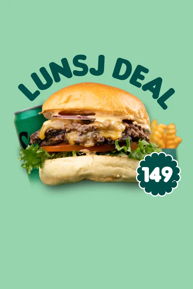 Lunsjdeal med saftig hamburger, smeltet ost, salat, tomat og pommes frites på grønn bakgrunn.
